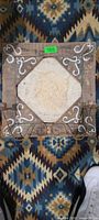Full view of rustic wooden wall hanging with angel relief and metal scroll bracket