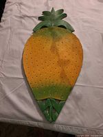 Front view showing painted design and perforations