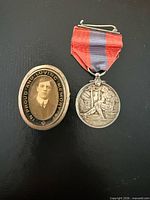 Medal and photo brooch together for size and contents overview