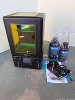 Front view of Anycubic Photon S printer with accessories