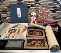 All items arranged: fans, scroll, mats, tray, boxes, origami doll