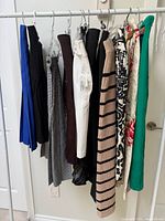 Rack displaying multiple skirts of various colours and patterns
