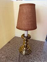 Lamp unlit showing brass base and shade