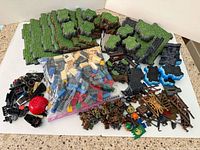 Full lot showing terrain plates, bag of bricks, minifigures, accessories