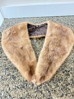 Top view of light brown mink collar showing V shape