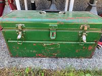 closed green metal toolbox front view