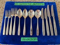 Full view of 12-piece Elkington silverplate flatware set: 4 forks, 4 spoons, 4 knives