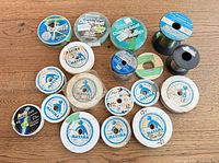 Group shot of all fishing line spools on table