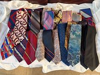 All ties spread out on white cloth