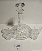 Decanter front with four tumblers