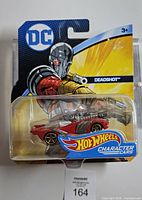 Front view of sealed Hot Wheels DC Deadshot Character Car on card