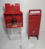 Front view of both red plastic coin banks