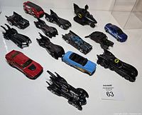 Top-down view of all 14 die-cast Batmobiles