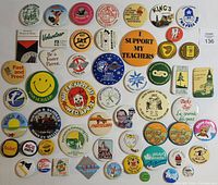Group shot showing full assortment of approx. 43 pinback buttons