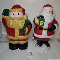 Front view of both Santa light figures