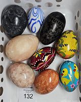 All nine decorative eggs grouped in basket