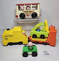 Group shot showing Mini Bus, locomotive with trailer and forklift, small car, multiple Little People figures