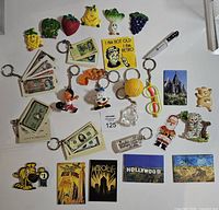 Full layout of keychains and magnets spread on surface