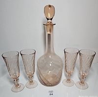 Full set showing decanter with stopper and four goblets