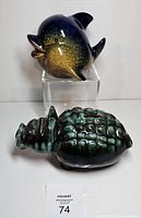 Front view of both coin banks showing shapes and glaze