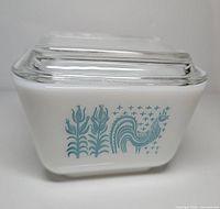Front view showing turquoise Amish Butter Print motif and clear lid