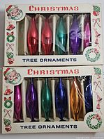 Two boxed sets of six elongated glass ornaments each