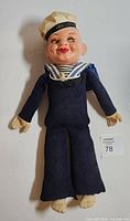 Front view of vintage Holland America sailor doll showing entire outfit and body.