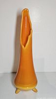 Front view showing full height, color gradient and tripod footed base
