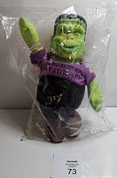Full view of sealed Frankenstein plush doll