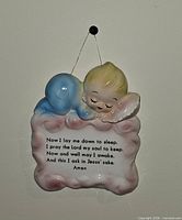 front of ceramic plaque showing children and prayer text