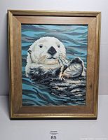 Full view of framed otter paint-by-number