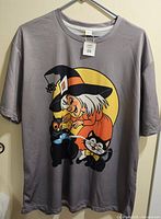Front of T-shirt showing witch and cats graphic