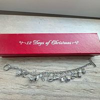 Bracelet displayed in front of red 12 Days of Christmas box