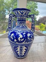 Front view showing full vase, pattern detail and handles