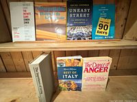 Front view of all seven books on shelf
