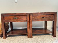 Front view of both matching end tables showing drawers, legs and lower shelves