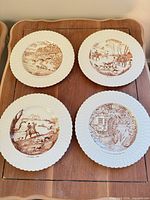 All four Royal Cauldon brown transfer plates on table