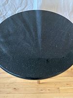 Top view showing round black granite surface