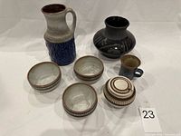 Front view of all seven ceramic pieces