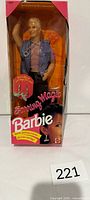 Front view of sealed Earring Magic Ken box showing doll and accessories