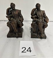 Front view of both cast metal Abraham Lincoln bookends