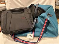 Punch teal travel bag and CODi black laptop briefcase, overall view