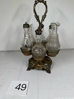 Full view of cruet set assembled, showing stand and six bottles