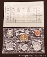Front view of specification card and sealed 6-coin strip