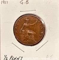 Obverse of 1911 half penny in flip showing King George V bust