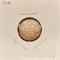 Reverse of 1914 Canada 10 cents coin showing denomination, crown and maple-leaf wreath