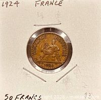Obverse view showing seated figure and 1924 date