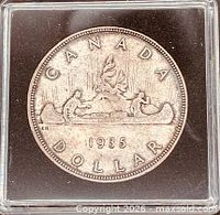 Reverse of 1935 Canada dollar showing canoe design