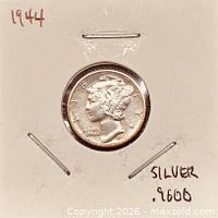 Coin in 2x2 holder, obverse date visible