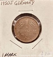 Full view of coin in holder, obverse side with date and denomination visible